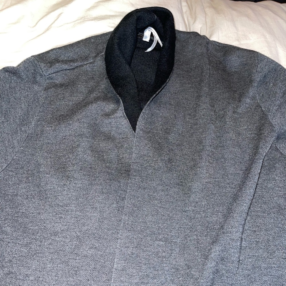 size L Leo and Nicole cardigan with a slit down each side.